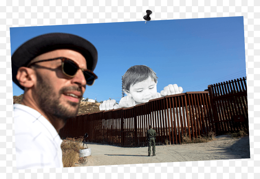 779x520 Jr Places Giant Baby At U Giant Portrait Of Toddler Peers Over Us Mexico Border, Person, Human, Sunglasses HD PNG Download